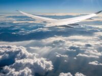 An airplane on flight among the clouds