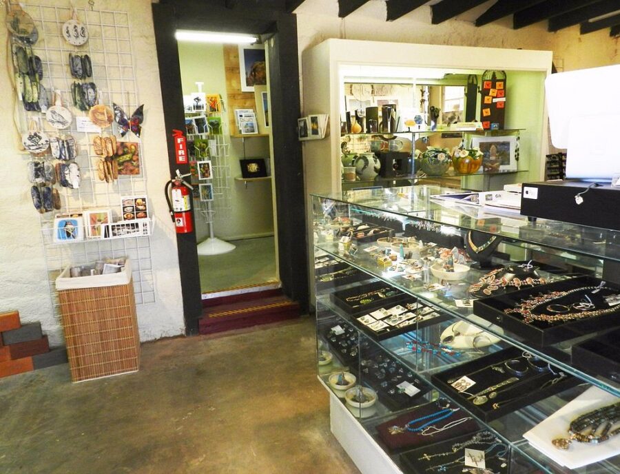 Interior view of the 29 Palms Art Gallery showcasing an array of jewelry and artistic items for sale in Twentynine Palms.