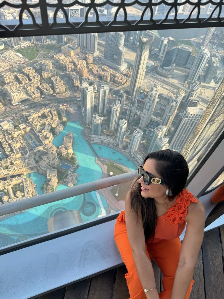 Woman enjoying the view At The Top, Burj Khalifa