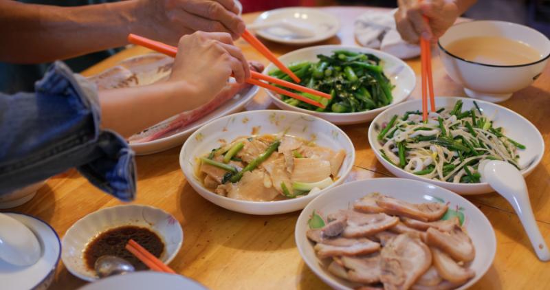 Tourists eating vietnamese cuisine