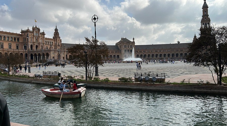 People on a boat touring El Centro in Seville