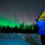 Tourists checking out Finland aurora borealis