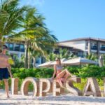 Couple picture taking at Lopesan signage