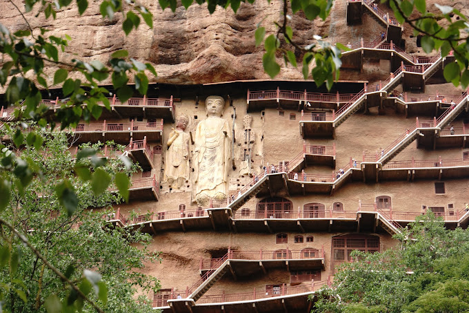 Steps and deities on the wall at Maijishan Grottoes
