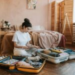 Woman packing suitcase