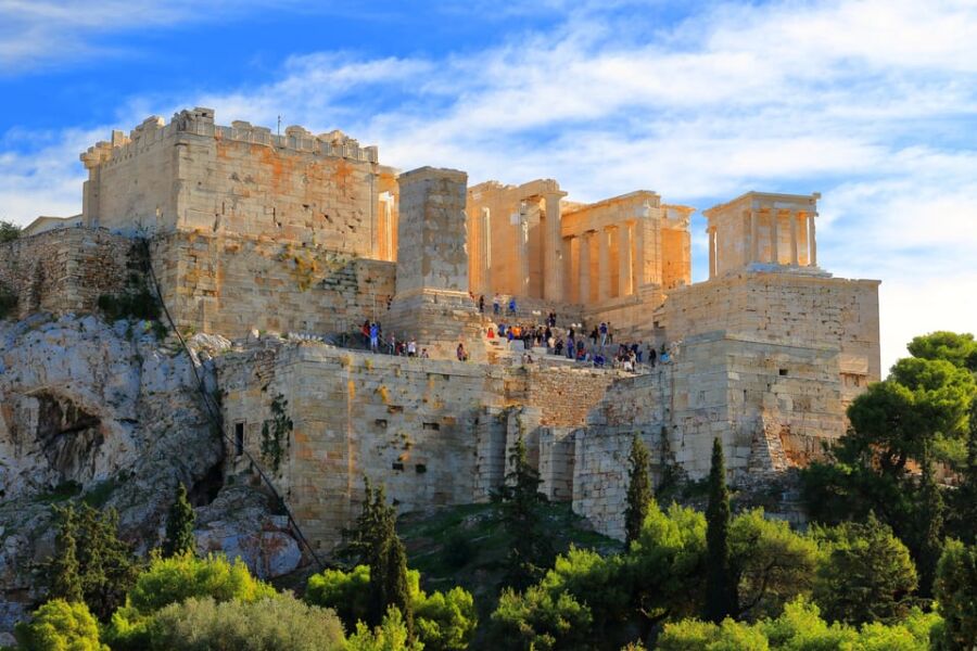 People gathering around the ruins at Parthenon