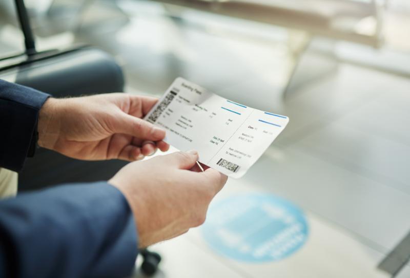 Plane ticket in hands