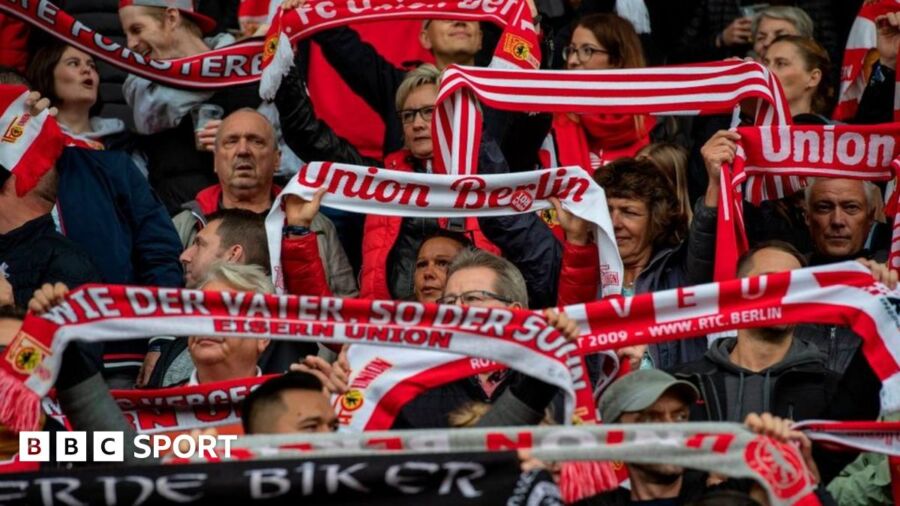 Red and white scarves fill the air as Union fans