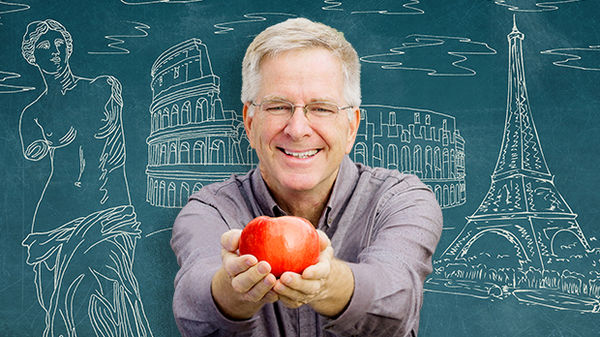 Rick Steve offering an apple