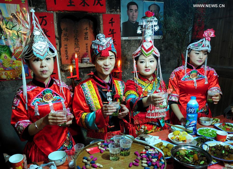 She ethnic people celebrating wedding at She Ethnic Minority Palace of China