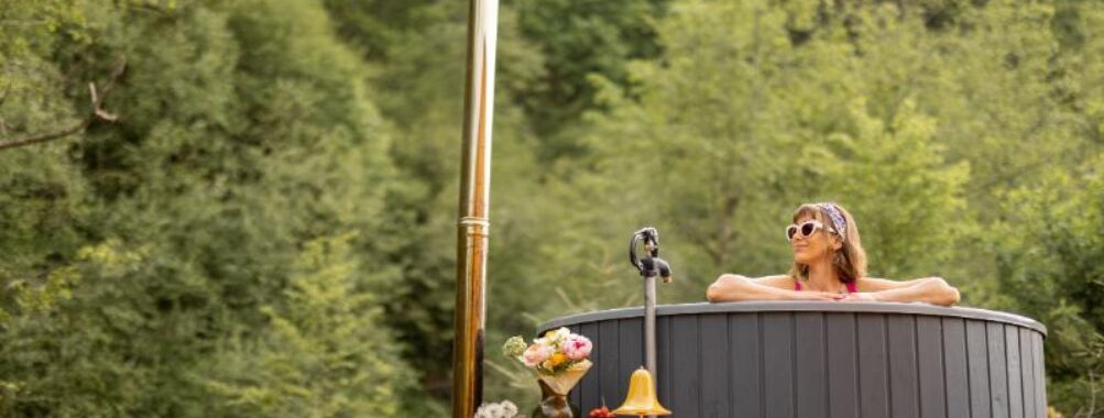 Woman bathing in hot tub on nature