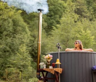 Woman bathing in hot tub on nature