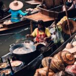 Woman selling on a boat in Bangkok