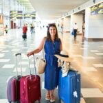 Woman traveler with luggages