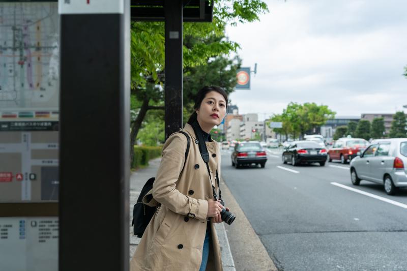 Woman waiting for a bus