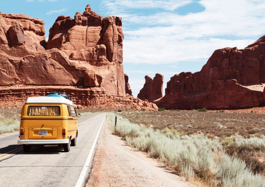 Yellow VW camper van in the road