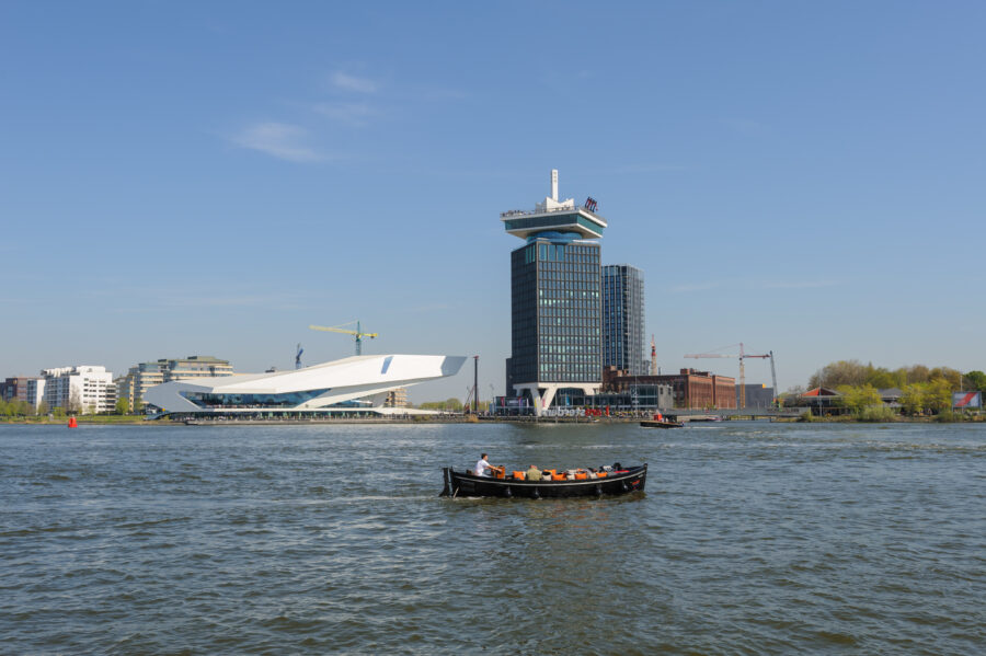 Panoramic view of Adam Lookout alongside The Eye film museum, highlighting Amsterdam's unique architectural landscape.