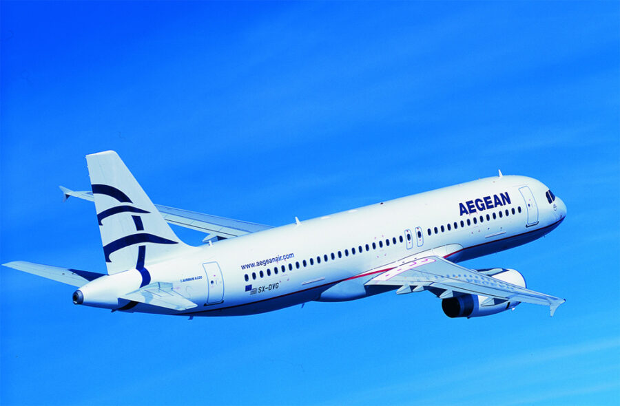 Aegean Airlines aircraft SX-DVG flying under clear blue sky, highlighting modern aviation technology.