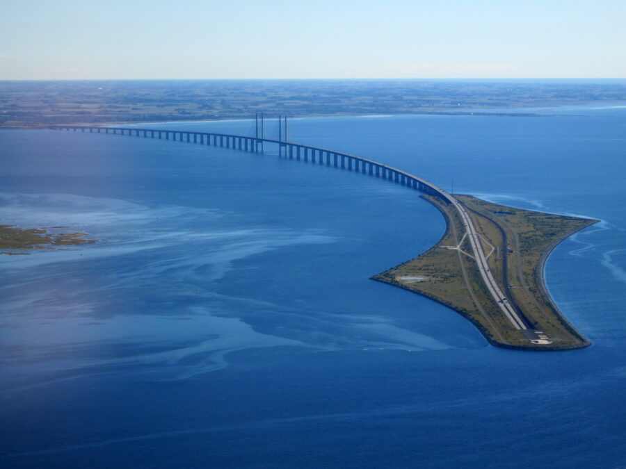Aerial view of Oresund Bridge causeway and cable-stayed span between Denmark and Sweden.