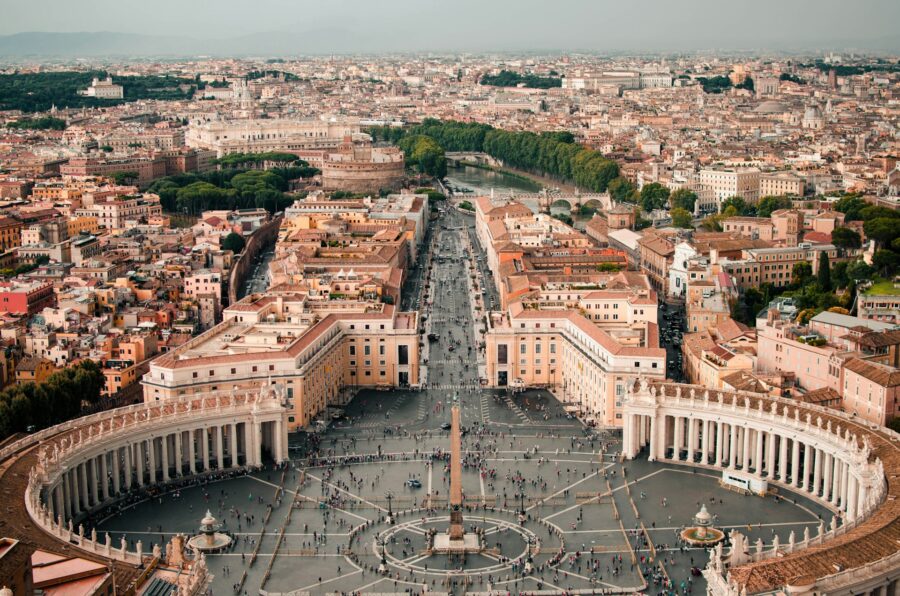Aerial view of St. Peters Square, Vatican City, Rome with obelisk and colonnades.