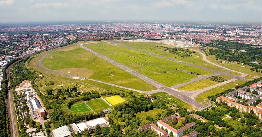 Aerial view of Tempelhofer Feld Berlin former airfield turned urban park with runways and sports pitches.