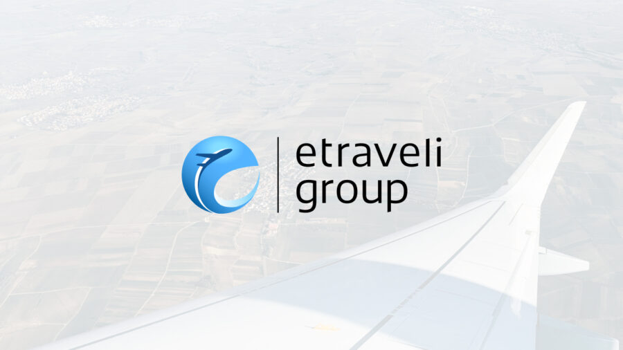 Aerial view with airplane wing and Etraveli Group logo, symbolizing travel and exploration.