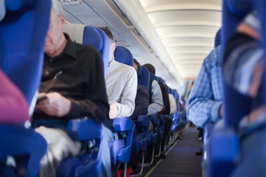 Airplane cabin aisle, providing access between rows of seats for passengers and crew