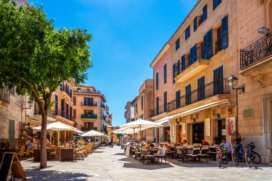Aerial view of Alcúdia's historic old town in Mallorca, showcasing its medieval architecture and charming narrow streets