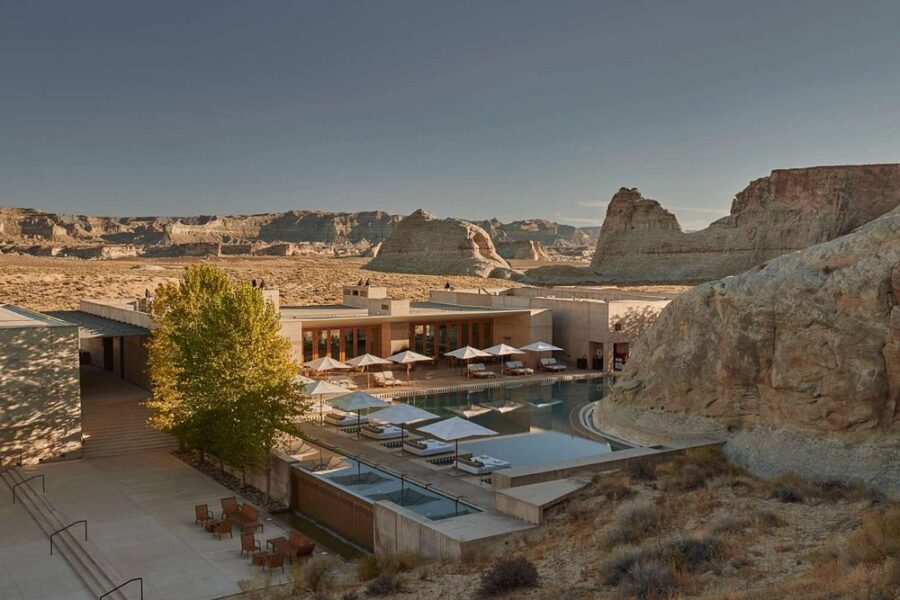 Amangiri hotel in Big Water, Utah, showcasing a serene pool area with chairs against a desert backdrop.