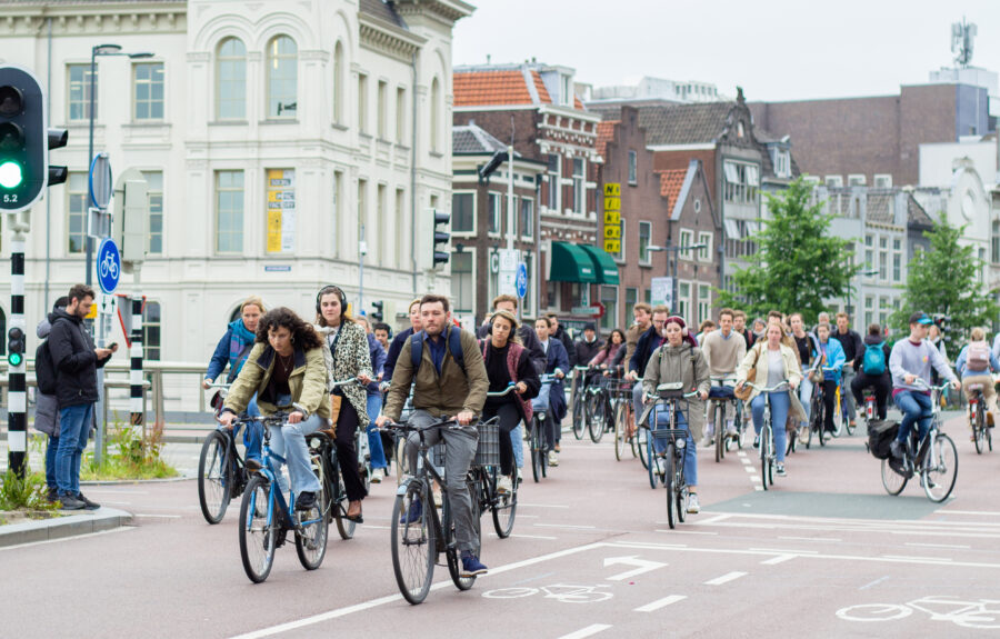 Amsterdam cyclists on busy bike lanes for World Bicycle Day in the Netherlands.