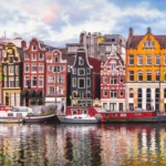Amsterdam Netherlands dancing houses over river Amstel landmark