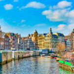 The breathtaking skyline of Amsterdam in early spring, highlighting its fabulous buildings and vibrant atmosphere