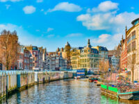 The breathtaking skyline of Amsterdam in early spring, highlighting its fabulous buildings and vibrant atmosphere