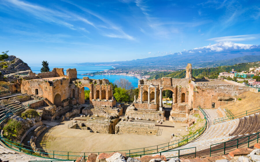 Taormina's ancient Greek theatre framed by the majestic Mount Etna, highlighting Italy's cultural and natural beauty