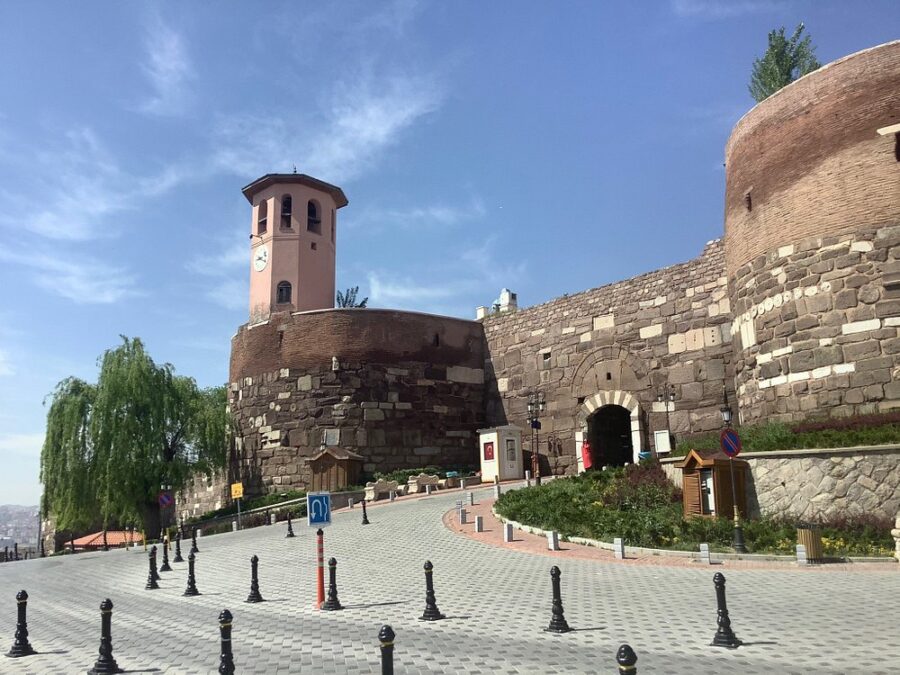 Ankara Castle in Turkey, showcasing a large brick structure topped with a distinctive clock tower.