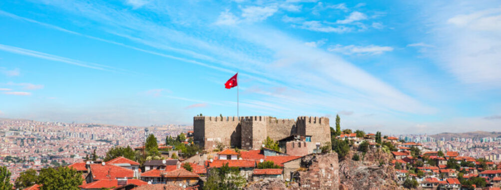 Ankara Castle stands against a bright blue sky in Ankara, Turkey, showcasing its historic architecture and scenic backdrop.
