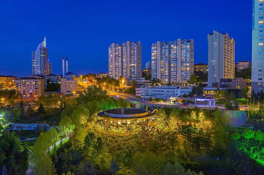Highway with tall buildings in the background, showcasing the urban landscape of Söğütözü, Ankara.
