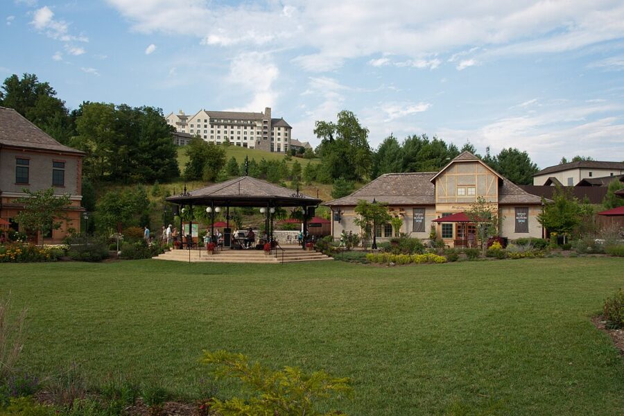 Scenic grassy space with a gazebo and a building, located in Antler Hill Village & Winery.