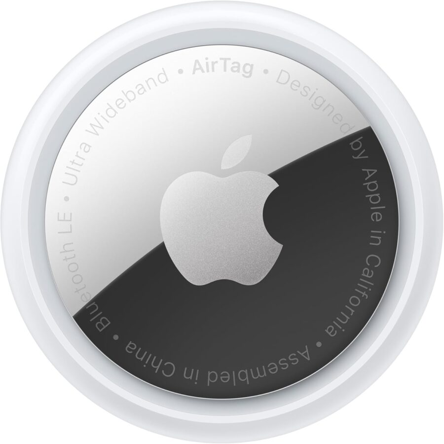 Sleek circular Apple AirTag with a silver Apple logo on a shiny metallic surface. Surrounded by text detailing features and origin. Modern and minimalistic design.
