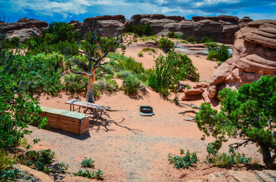 Campsite in Arches National Park, Moab, Utah among vibrant red rocks and desert scenery