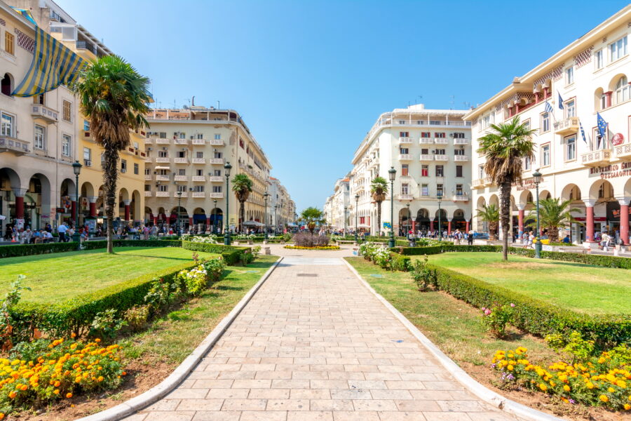 Aristotelous Square in Thessaloniki, Greece, bustling with people and surrounded by historic buildings and cafes