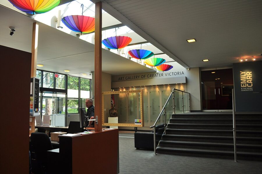 Lobby of the Art Gallery of Greater Victoria featuring a receptionist desk and a staircase in British Columbia.