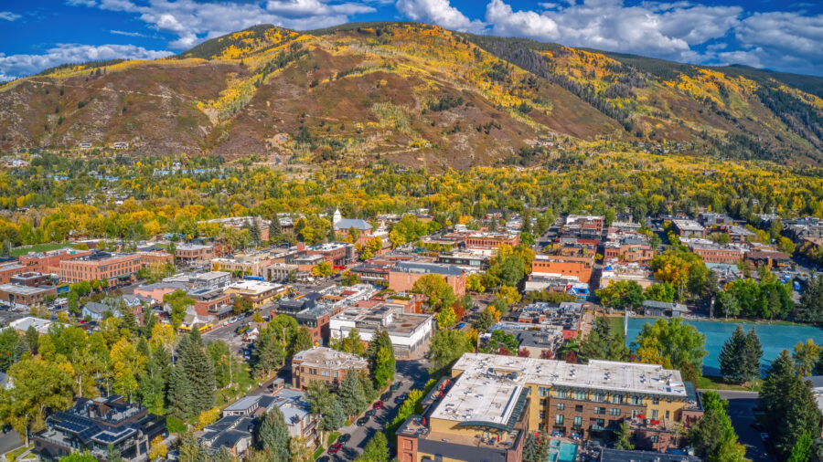 Aerial view of Aspen, Colorado, showcasing vibrant autumn foliage and mountainous