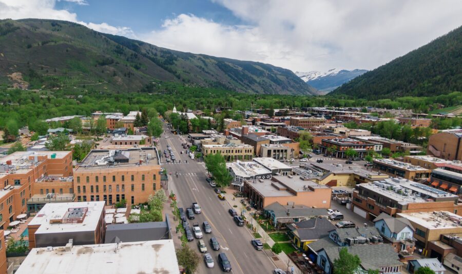 Aerial view of Aspen, Colorado, showcasing the ski town's charming layout and surrounding snow-capped mountains