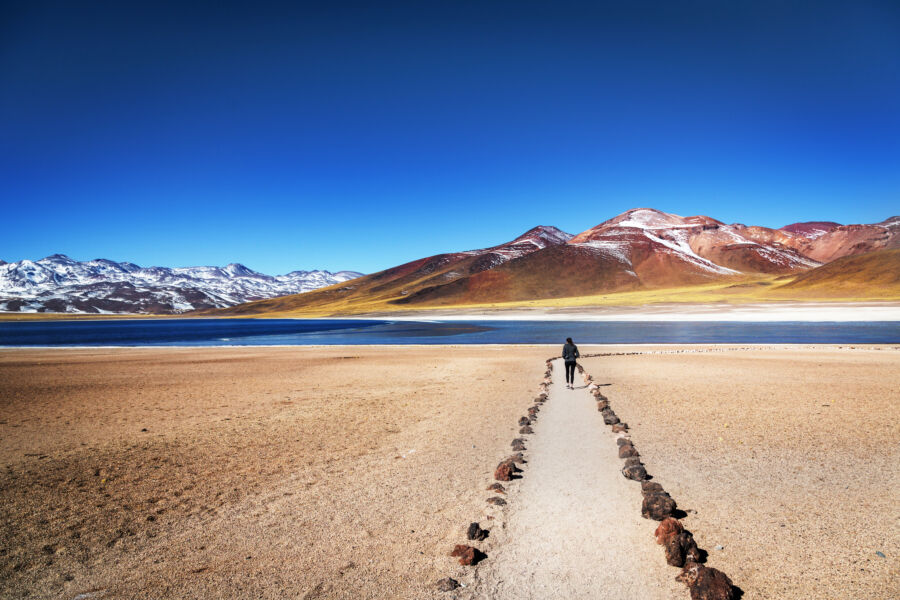 Tourist enjoying the beautiful landscape of Atacama Desert in Chile.
