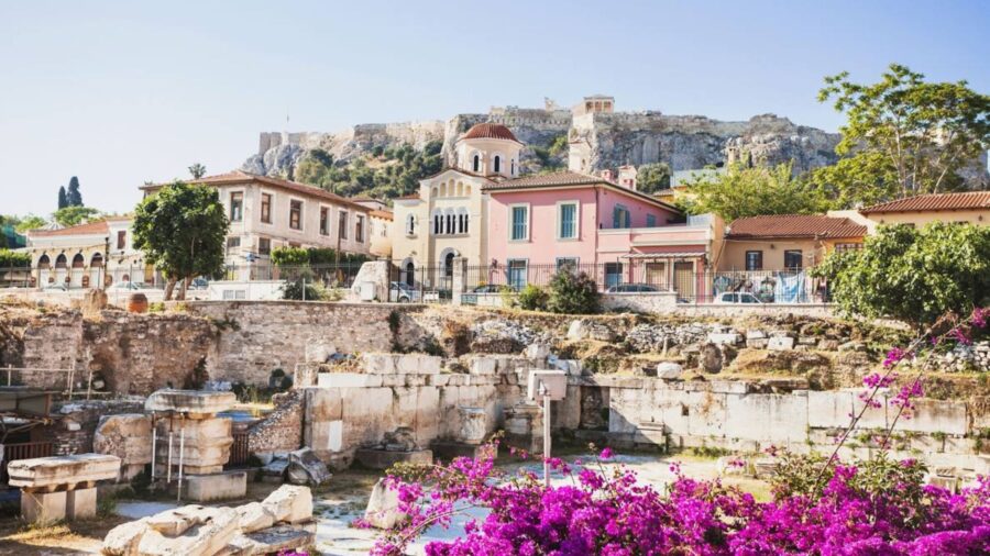 Ancient ruins meet modern Mediterranean architecture near Athens iconic Acropolis.