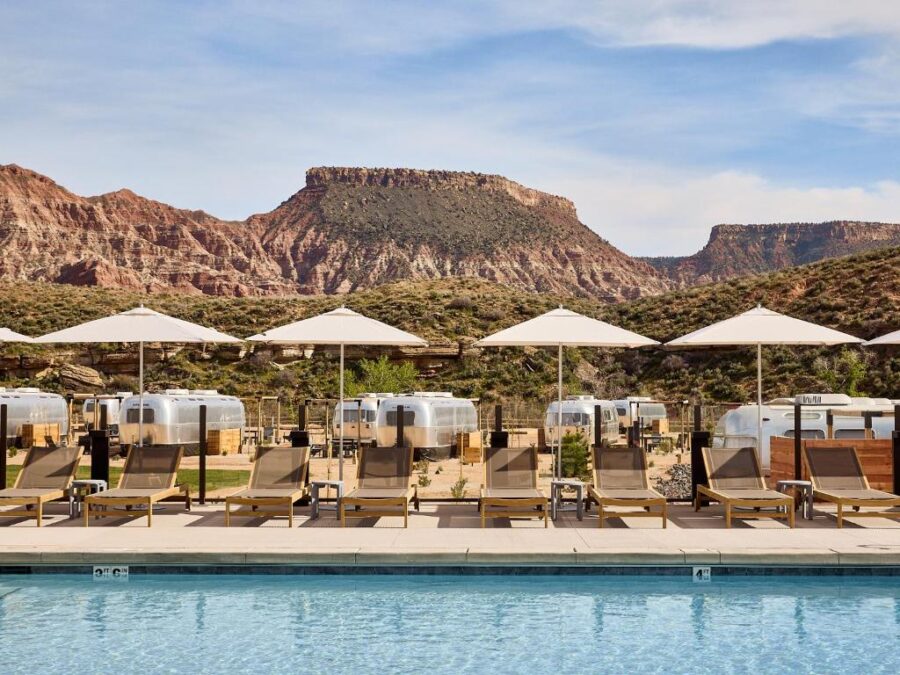 The pool at the Grand Canyon, surrounded by scenic views, offers a relaxing atmosphere for guests at Autocamp Zion.
