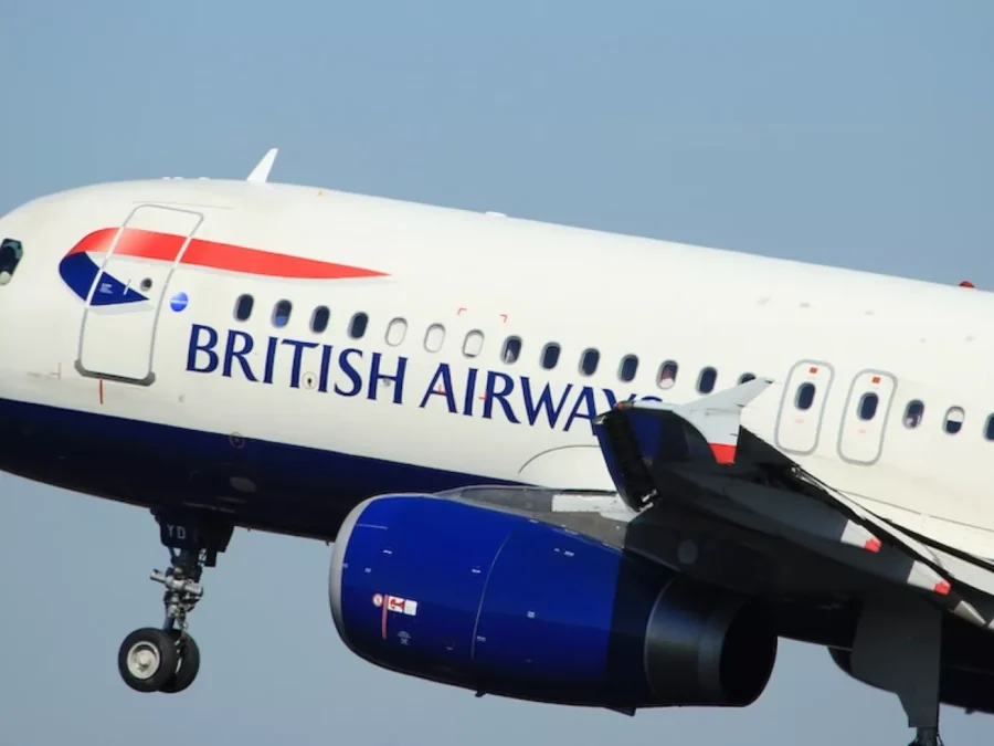 British Airways aircraft in flight showcasing dynamic design and iconic color scheme.