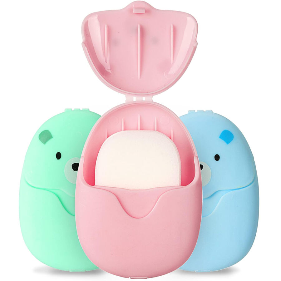 Three colorful soap dispensers with a bear inside, featuring BAIKAFU biodegradable travel soap sheets.