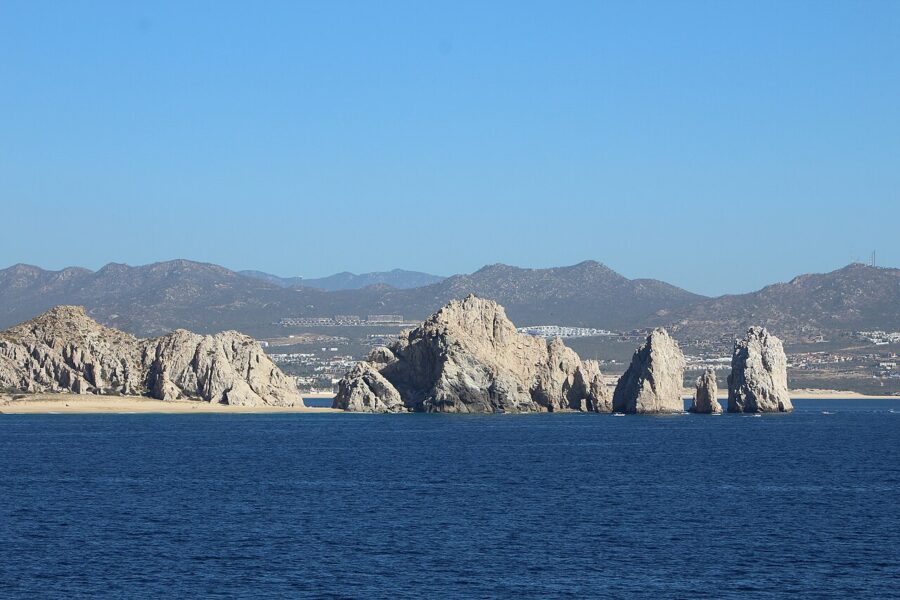 Expansive water with scattered rocks, showcasing the natural beauty of the Baja California Peninsula in Mexico.